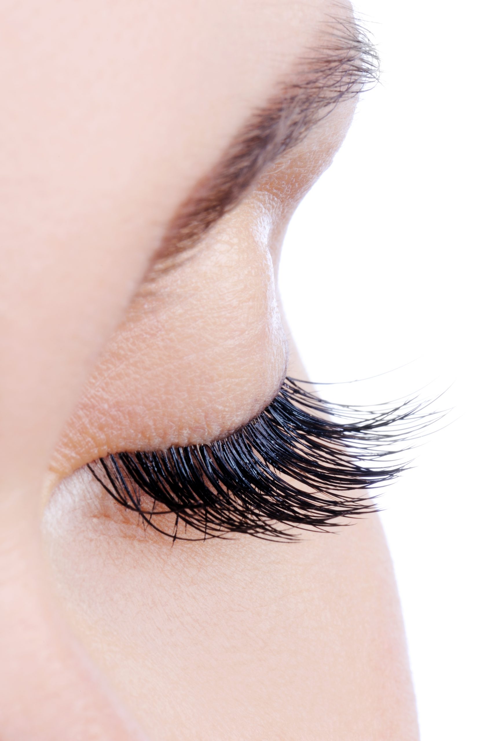 female eye with long false eyelashes