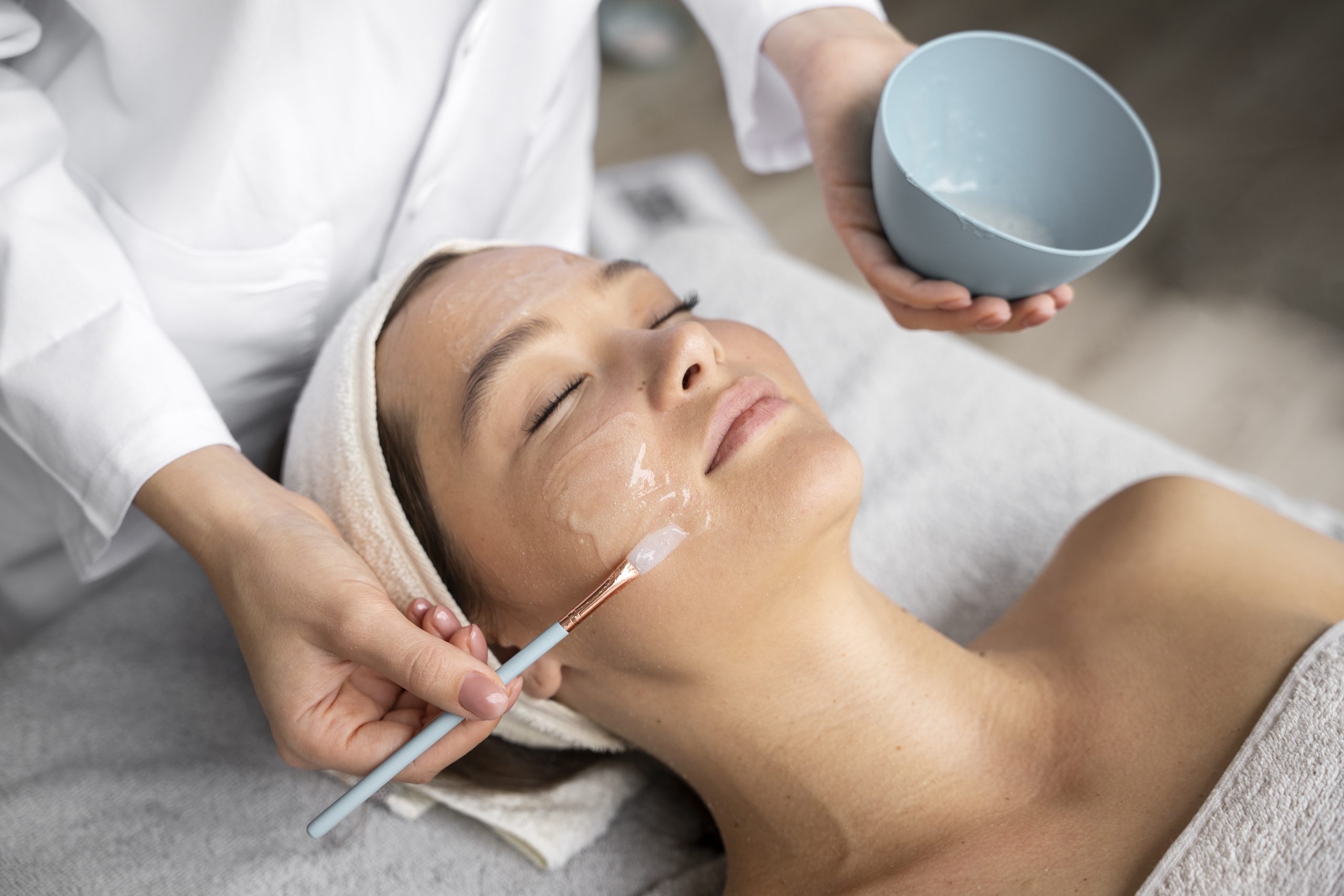 high-angle-woman-getting-massaged-spa